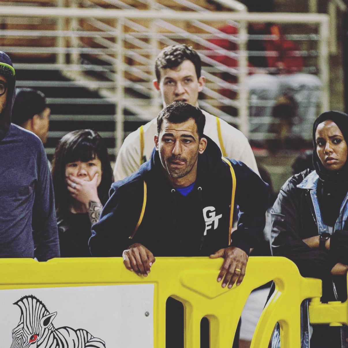 Professor Deivid Dias coaching on the mats