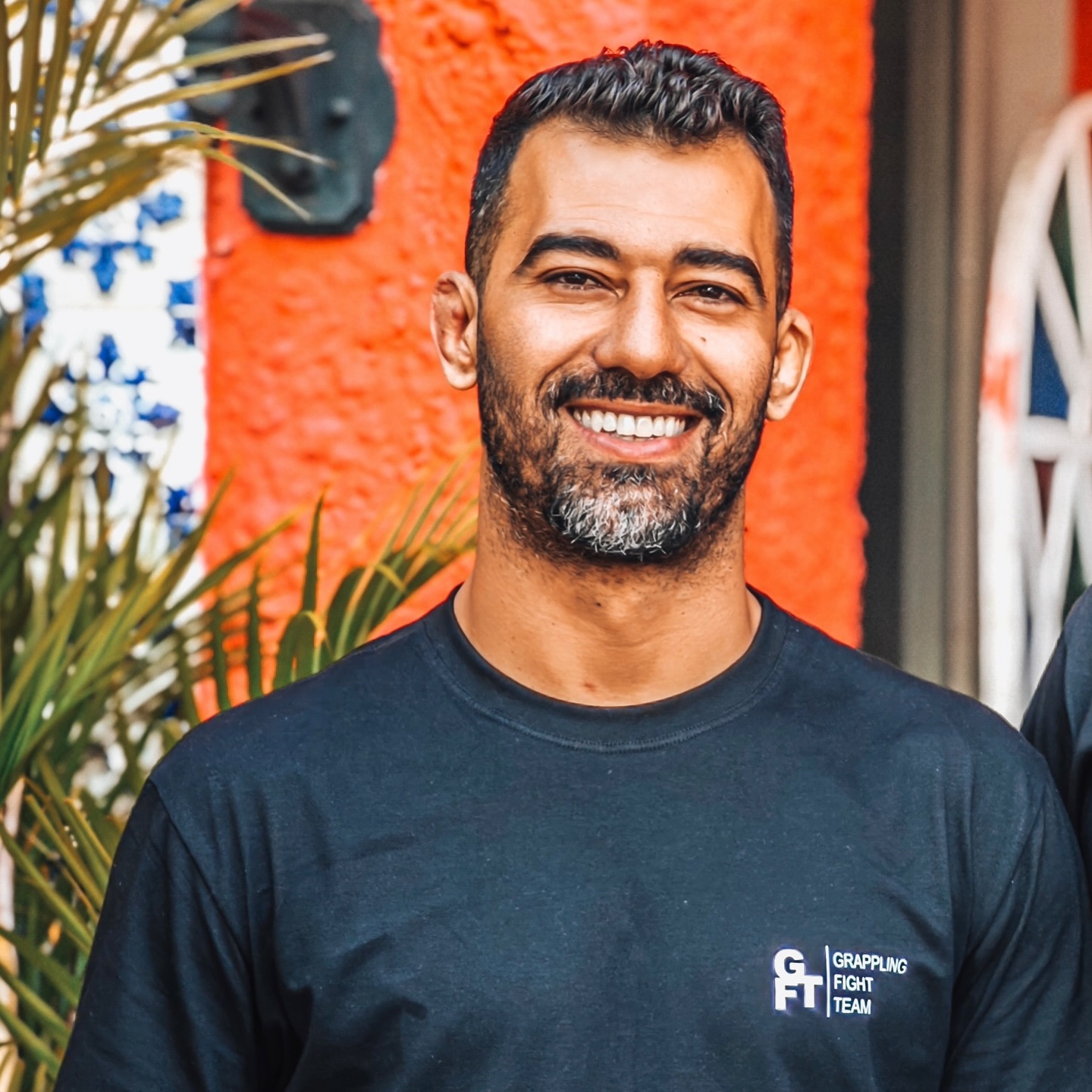 Deivid Dias smiling in a black Grappling Fight Team shirt